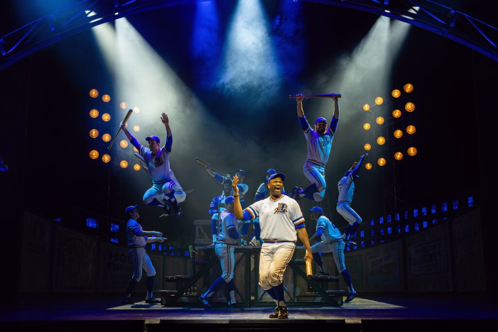 Nik Walker and the company of "Bull Durham."