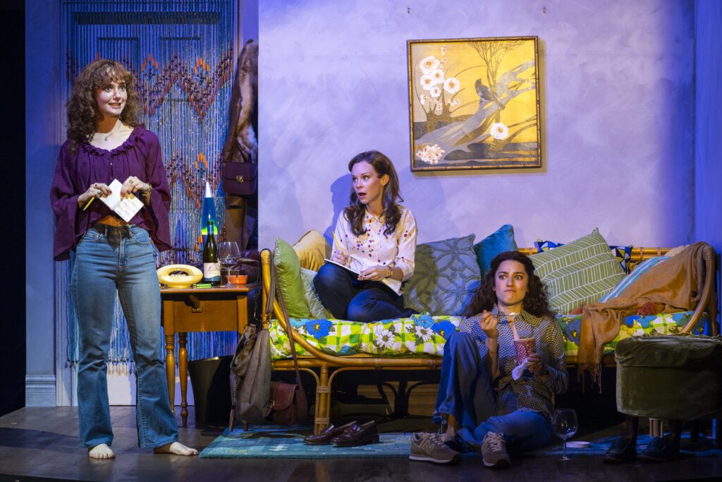 Taylor Richardson as Laraine Newman, Caitlin Houlahan as Jane Curtin, and Evan Rubin and Gilda Radner in "Not Ready for Prime Time."