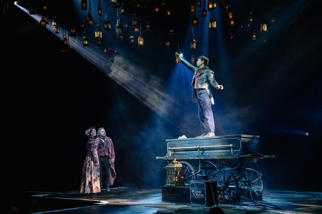 Ashlyn Maddox, Michael Cerveris, and Maxim Chlumecky in "A Christmas Carol" at PAC NYC.