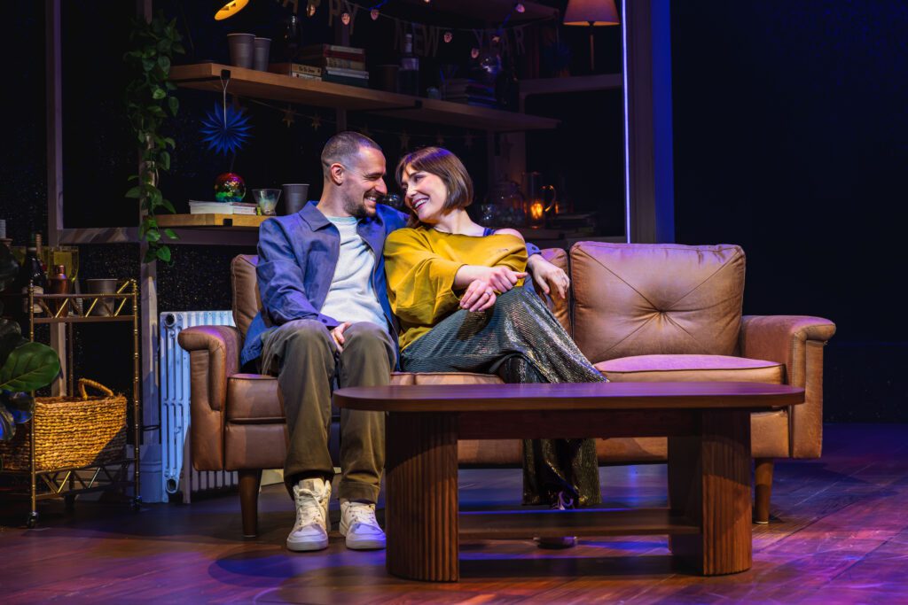 Austin and Marideth Telenko sitting on a couch in '11 to Midnight.'