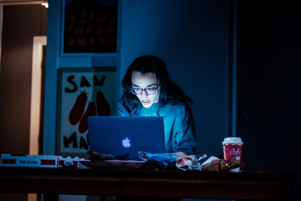 Midori Francis sits at a laptop computer in a scene from 'Sylvia Sylvia Sylvia' at Geffen Playhouse.