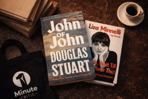 1MC curated bookshop flat lay featuring John of John by Douglas Stuart and Kids Wait Till You Hear This by Liza Minnelli with 1 Minute Critic tote bag