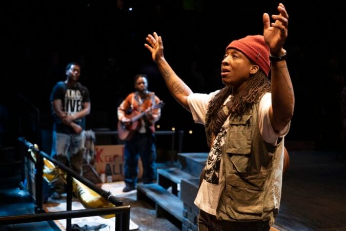 Esco Jouléy (front), Namir Smallwood, and Jon Michael Hill in Steppenwolf Theatre Company’s world premiere of "Windfall."