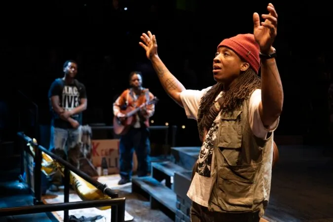 Esco Jouléy (front), Namir Smallwood, and Jon Michael Hill in Steppenwolf Theatre Company’s world premiere of "Windfall."