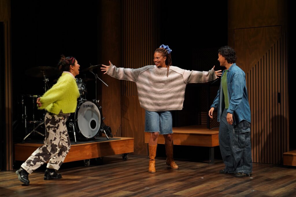 Yeena Sung, Hillary Fisher, and Naomi Latta in "||: Girls :||: Chance :||: Music :||" Photo by Carol Rosegg.