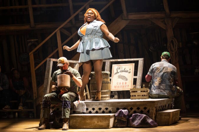 Alex Newell (center) in "Shucked."