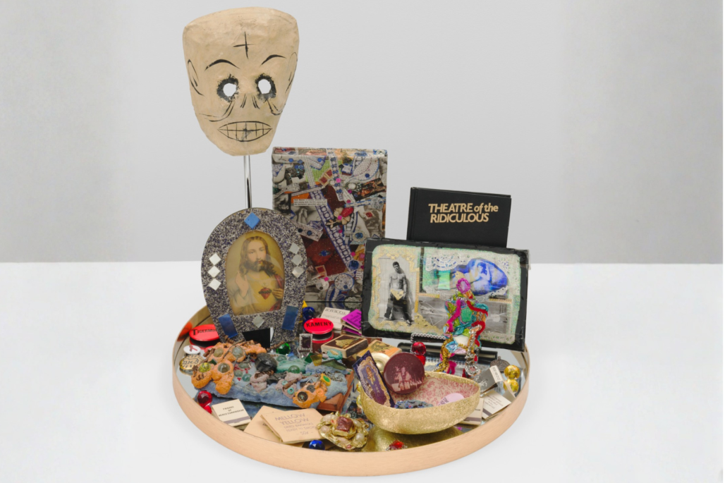 Agosto Machado, Downtown (Altar), 2024. Pins, matchbooks, mirror, and papier-mâché; plastic and metal objects; book (Theater of the Ridiculous), photograph, jewelry, bananaflavored straw packets, New York City subway tokens; and original artworks by Arch Connelly, Thomas Lanigan-Schmidt, and Gilda Pervin. Collection of Jane Hait. © Agosto Machado. Image courtesy the artist and Gordon Robichaux, NY. Photography by Greg Carideo